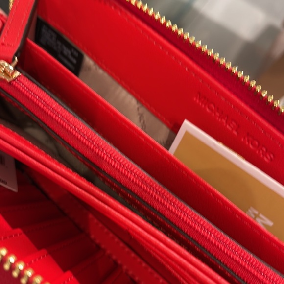 MICHAEL KORS Leather Continental Phone Holder Wristlet Wallet
Dark Sungria
NWT - Picture 15 of 16